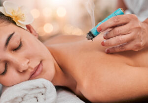 Physical therapy, aromatherapy and spa woman in healing, healthcare and wellness treatment for body.